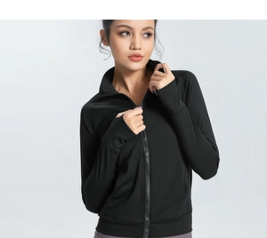 Close-up of black slimming sports jacket thumbholes and elastic quick-dry fabric
