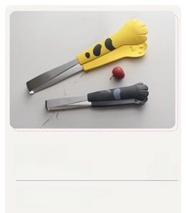 Detail of cat paw food tongs with non-slip silicone pads and stainless steel handle