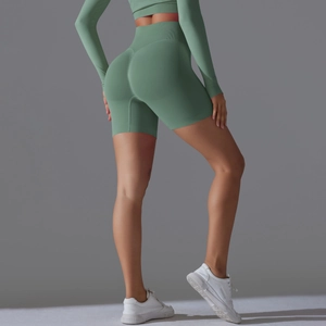 Detail of avocado green seamless yoga shorts with high waist and scrunch butt lifting effect