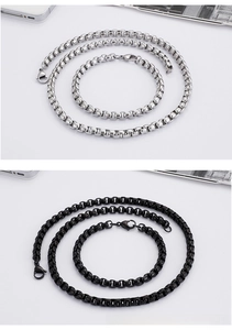 Detail of silver and black stainless steel box chain necklaces and bracelets with lobster clasps