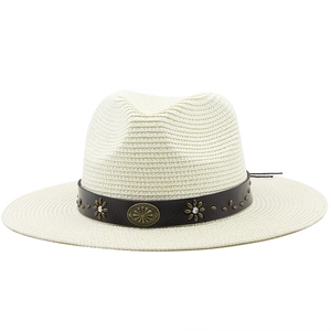 Detailed view of woven straw hat featuring vintage leather band with floral metal studs