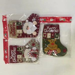 Detailed close-up of Santa Claus, Snowman and Reindeer plush Christmas stockings