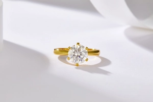 Macro shot of a classic six-prong solitaire ring with a brilliant round moissanite