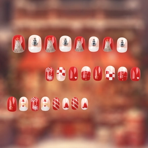 Christmas themed press-on nails set featuring red and white patterns with festive icons