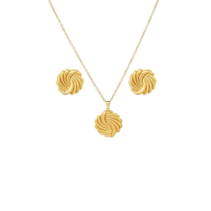 Detailed studio shot of golden spiral leaf necklace and earrings jewelry set on white background