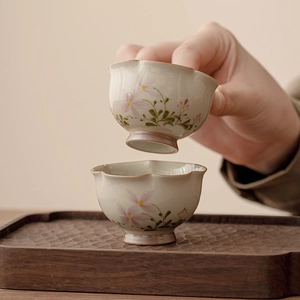 Handcrafted daisy flower ceramic teacup set with petal-shaped rim and wooden tray base