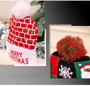 Detail of Christmas knitted hat featuring festive patterns and fluffy colorful pom-poms
