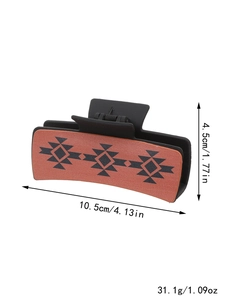 Brown western leather hair claw clip showing dimensions 10.5cm by 4.5cm and weight 31.1g