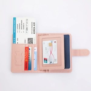 Detail view of pink leather RFID passport holder with dedicated SIM card slots and card slots