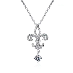 Macro detail of silver iris flower pendant featuring sparkling diamonds on a white background