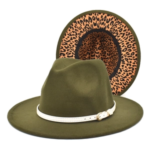 Detail of olive green fedora hat featuring leopard print brim and white leather belt