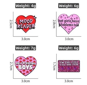Detailed view of four enamel pins with slogans and precise product size dimensions
