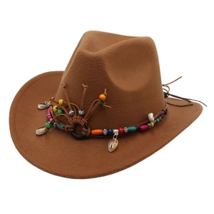 Brown wool cowboy hat with ethnic beaded band and shell charms shown from 45-degree angle