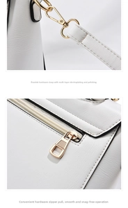 Detail of light gold metal buckle and smooth back zipper on white lychee leather bag