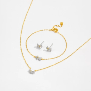 Elegant S925 silver jewelry set featuring golden puppy pendants with sparkling cubic zirconia