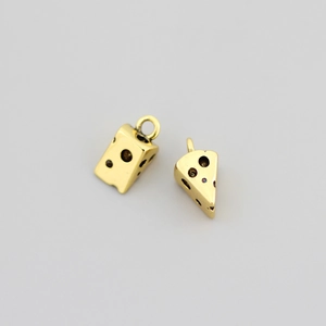 Macro shot of 18K gold plated copper cheese cake pendants with textured surface detail
