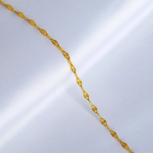 Elegant 18K gold-plated titanium steel necklace chain on white silk background