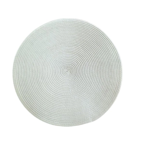 Close-up of a circular woven placemat in off-white featuring a minimalist spiral texture