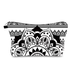 Macro detail of mandala flower pattern on black and white travel makeup bag with zipper
