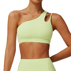 One-shoulder asymmetrical light green yoga bra with teardrop cutout and matching leggings
