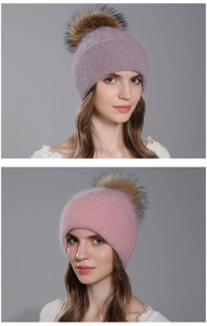 Close-up detail of women's Angora rabbit hair knitted beanie with a fluffy fur pom-pom.