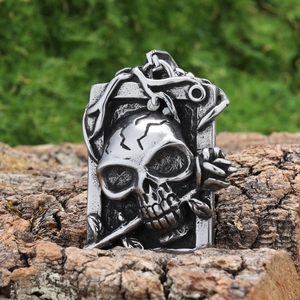 Gothic skull and rose rectangular pendant in vintage silver finish on bark background