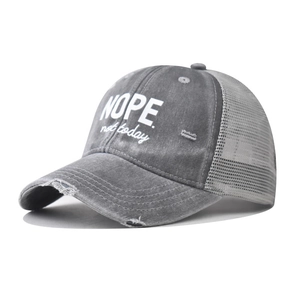 Detailed side view of smoke gray distressed mesh baseball cap with NOPE not today embroidery