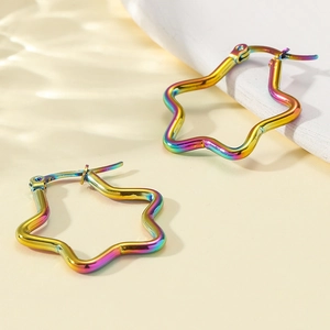 Rainbow iridescent star hoop earrings made of minimalist stainless steel on a warm base