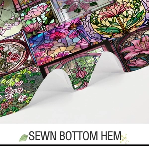 Close-up of sewn bottom hem on a colorful floral stained glass pattern fabric shower curtain