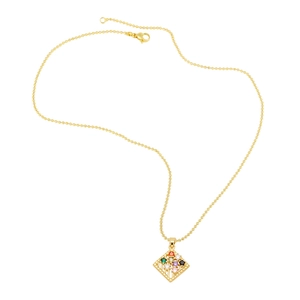 Detailed macro of gold beaded chain and square pendant with multi-color zircon stones