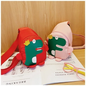 Detail of cute dinosaur chest bags for kids in red and pink with adjustable nylon straps