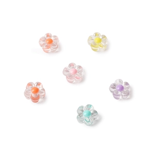 Macro shot of 6 colorful acrylic flower beads for DIY jewelry making on white background