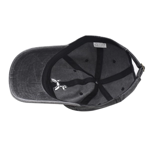 Detail of internal cotton sweatband and embroidered balloon dog logo on grey cap