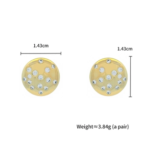 Macro shot of gold circular earrings with zircon stones and size specs 1.43cm