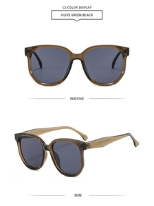 Détail de lunettes de soleil papillon surdimensionnées vert olive avec verres gris