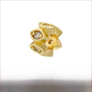 Macro view of 18K gold plated brass spacer bead with cubic zirconia stones, size 4x6mm