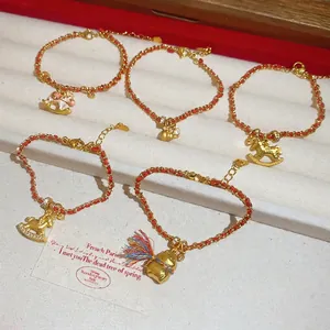 Bracelets en corde rouge plaqués or 24 carats avec breloques cheval et sac de monnaie