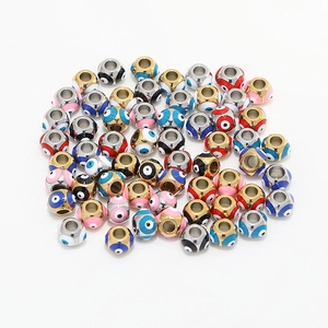 Macro shot of 8mm colorful Evil Eye beads made of stainless steel for DIY jewelry making