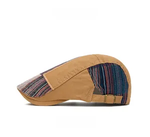 Side view of retro newsboy hat featuring khaki canvas and striped fabric patchwork