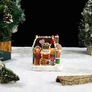 Detailed close-up of a glowing gingerbread house candy shop with festive LED lights