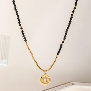 Minimalist black spinel evil eye necklace with gold disc pendant and tiny beads