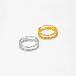 Detailed close-up showing S925 hallmark on double-layered silver and gold rings with pavé cubic zirconia