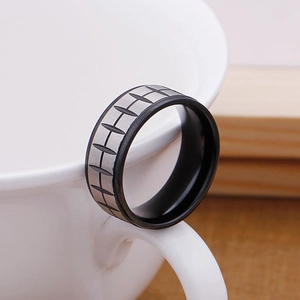 Detail of tire tread pattern ring with black inner coating on a white ceramic cup edge