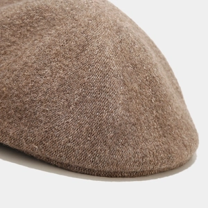 Close-up of the high-quality brown wool fabric texture on this retro beret hat