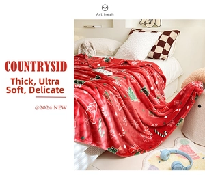 Detail of thick Christmas red flannel blanket with festive holiday prints and soft texture