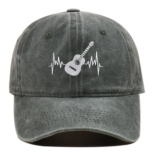 Close-up of guitar heartbeat embroidery on washed cotton fabric of the baseball cap