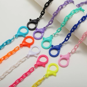 Detail of colorful resin mask chains with matching plastic lobster clasps in 10 vibrant shades