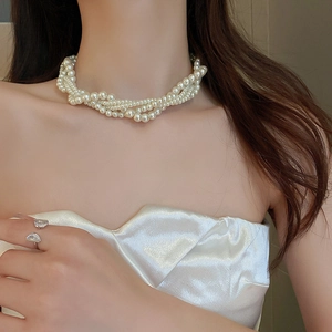 Elegant multi-layer baroque pearl choker necklace with a twisted vintage design