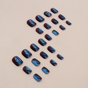 Korte vierkante aurora plaknagels in blauw-paars cateye effect met gouden folievlokken