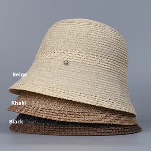 Three-color foldable straw bucket hats in beige khaki and black with metal petals
